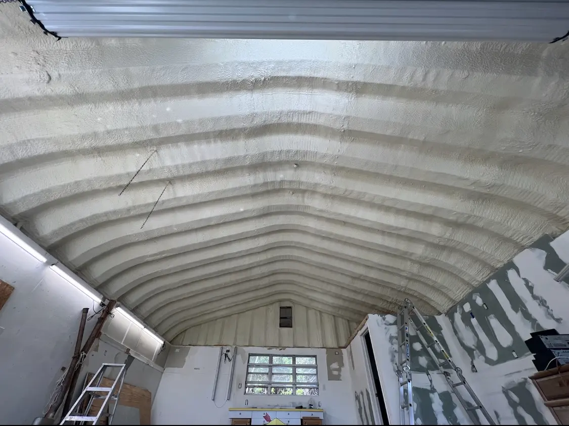 Spray polyurethane foam applied to the underside of a metal roof deck in Yorkville